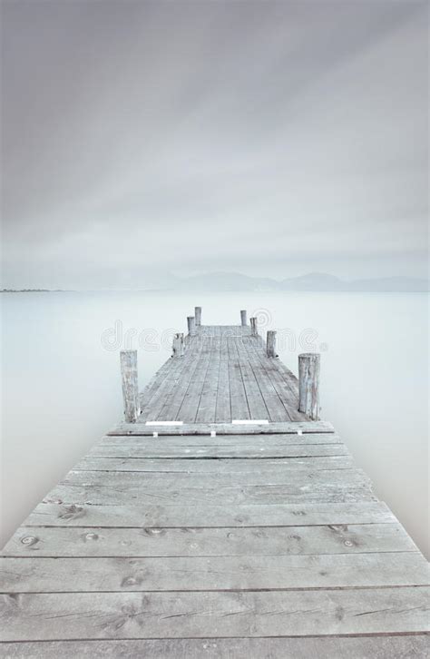Wooden Pier Or Jetty And A Boat On A Lake Sunset Versilia Tuscany