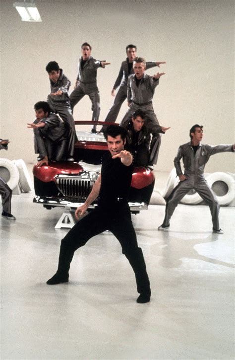 John Travolta As Danny Zuko And The T Birds Grease Grease Movie