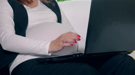 Pregnant Woman Belly And Hands Working With Laptop Computer Stock Footage