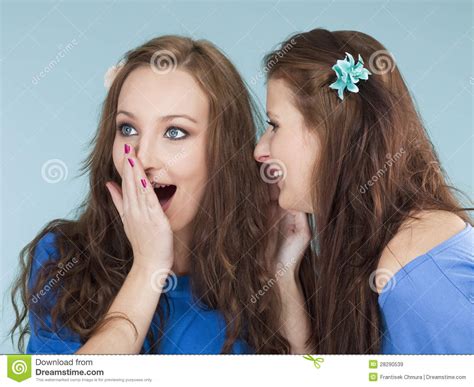 Two Young Female Friends Whispering Gossip Royalty Free Stock Images ...