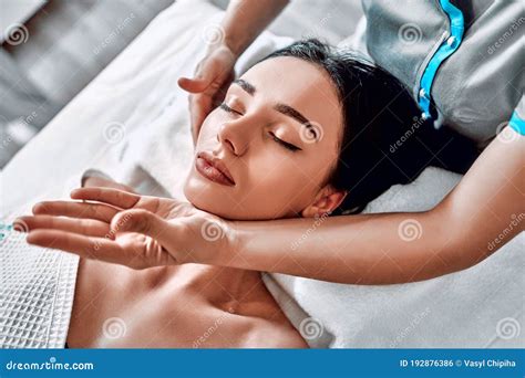 Manual Sculpting Face Massage For Young Woman In Beauty Clinic Massage Therapist Is Working On