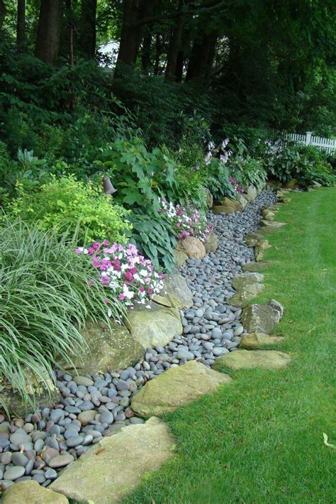 Gardens Edge With Large And Small River Stones Garden Edging