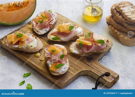 Rockmelon Bruschetta With Goat S Cheese And Prosciutto Ham Stock Image