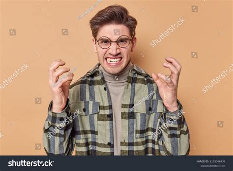 Irritated Young Man Gestures Angrily Clenches Stock Photo 2155366339