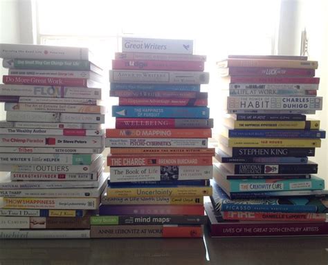 There Are Many Books Stacked On Top Of Each Other