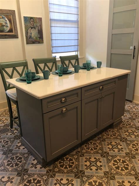 Not sure which white shaker cabinets are right for your space? #Blue #Gray #Shaker #Cabinets are paired with stunning hand-painted floor tile, white ...