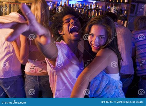 Young Man And Young Woman Dancing In A Nightclub Stock Image Image Of
