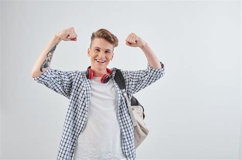 Premium Photo Excited Smiling High School Student Raising Arms And