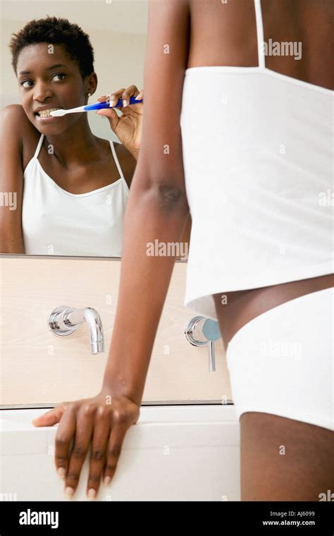 Woman Brushing Teeth Stock Photo Alamy