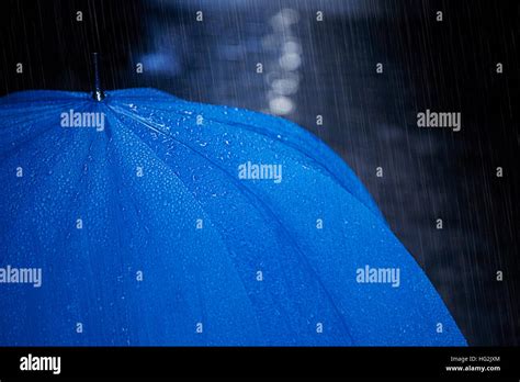 Umbrella In Raining Stock Photo Alamy