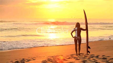 Surfer Girl at Sunrise: Royalty-free video and stock footage