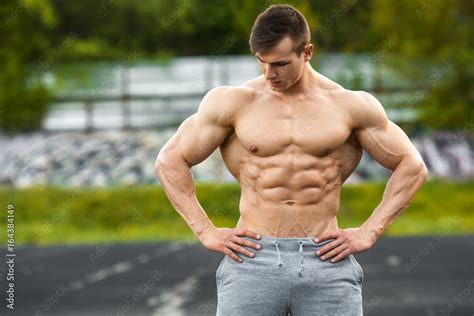 Muscular Man Working Out Outdoor Strong Male Naked Torso Abs Outside