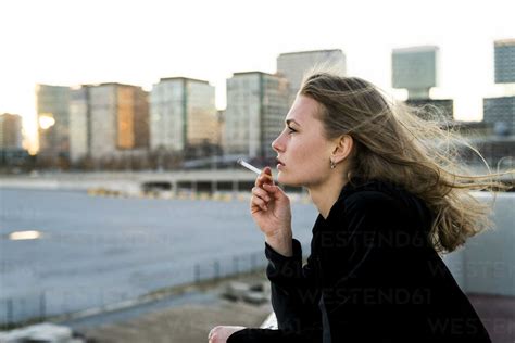 Spain Barcelona Pensive Young Woman Smoking Cigarette Kkaf00566