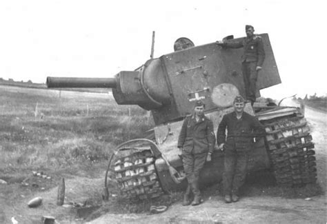 German Troops Posing In Front Of A Wrecked Kv 2 Heavy Russian Tank