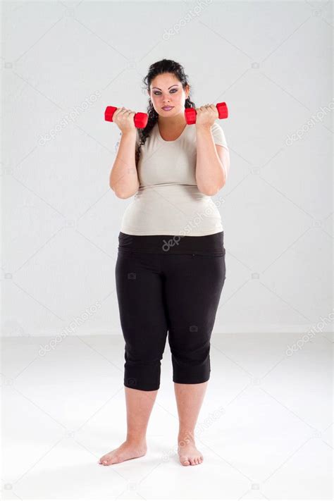 Plus Size Female Getting Ready To Exercise Stock Photo By ©michaeljung