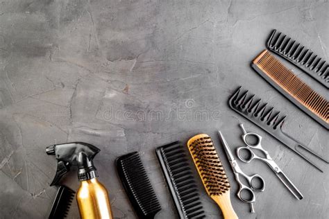 Hairdresser Set In Beauty Salon Combs Scissors Spray On Grey Desk