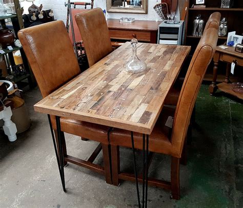 Fashioned on a cast iron pedestal base, the round pine top is braced in a rim of iron to connote progress amidst rustic conditions. Modern Rustic Industrial Style Dining Table from Reclaimed Wood | in Newport Road, Cardiff | Gumtree