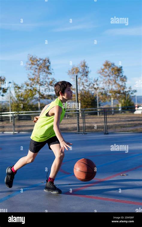 Full Length Of Boy Playing Basketball Stock Photo Alamy