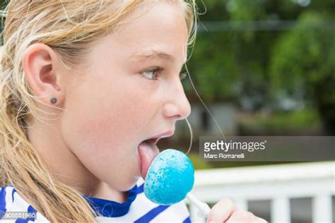Blonde Girl Licking Side View Photos Et Images De Collection Getty Images