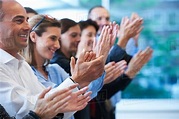 Group of people clapping - Stock Photo - Dissolve