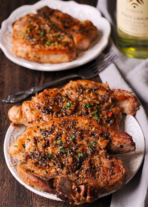 How long do you cook pork chops in the oven? Pan Seared Pork Chops with Garlic, Brown Sugar and Herbs ...