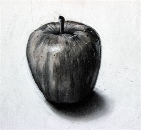 An Apple Sitting On Top Of A White Table