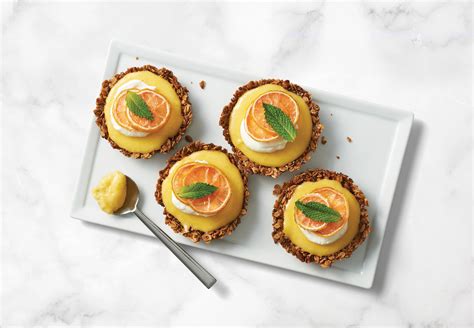 Granola Crust Tartlets With Pink Lemon Curd And Candied Pink Lemons Friedas Llc The Branded