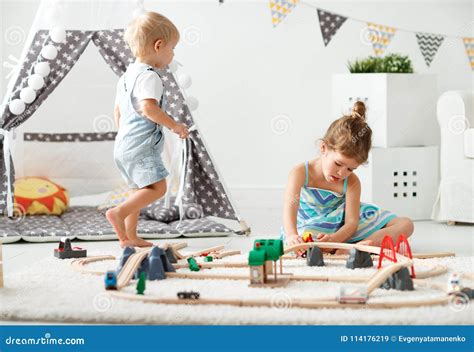 Happy Children Playing In Toys At Home In Playroom Stock Image Image