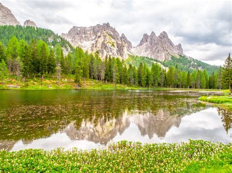 Mountain Summits Reflected In Water Of Antorno Lake Dolomites Italy