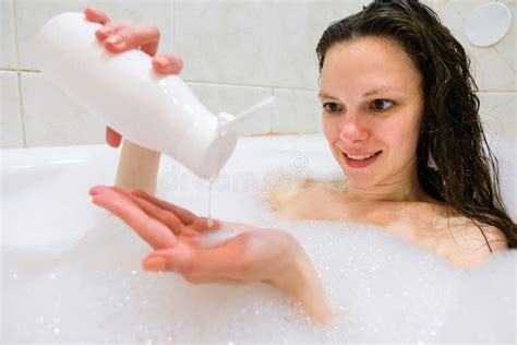 Brunette Woman Pouring Shampoo On Hand In Shower Stock Image Image Of