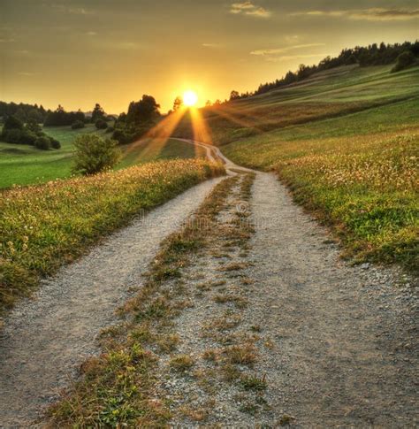 Sunset And Path Through A Meadow Stock Photo Image Of Mysterious