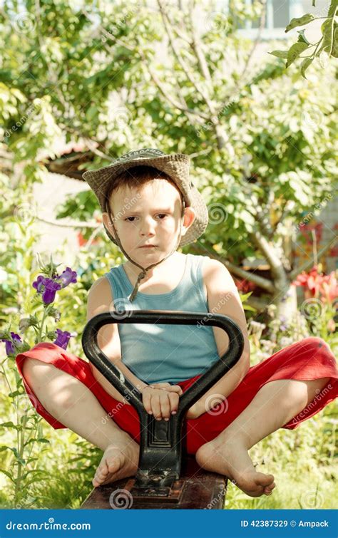 Barefoot Little Boy Playing In The Garden Stock Photo Cartoondealer