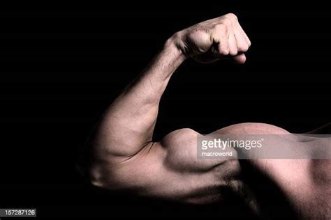 Man Flexing Biceps Photos And Premium High Res Pictures Getty Images