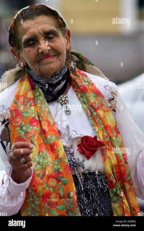 Old Gypsy Woman In Traditional Wear Dancing Outdoors On Street Stock