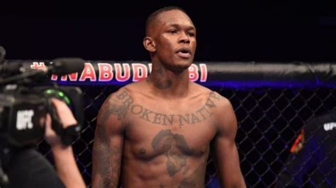 israel adesanya blames it on weed for his saggy right pec but says he won t stop smoking weed