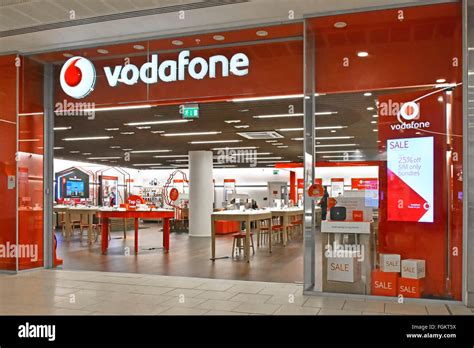 Vodafone Mobile Phone Store Shopfront Sign With Interior View Of Sales