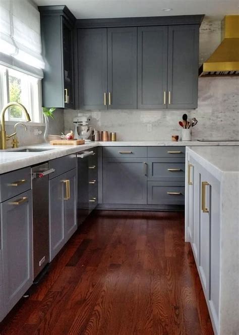 Stylish ideas for kitchen cabinet doors. Stunning gray kitchen with gold accents boasts cherry ...