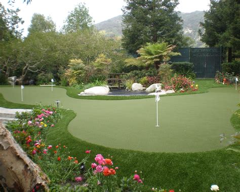 Install a putting green in your yard for ease and convenience when it comes to improving your game. Backyard Putting Green from Sport Court | Backyard putting green, Backyard, Putting greens