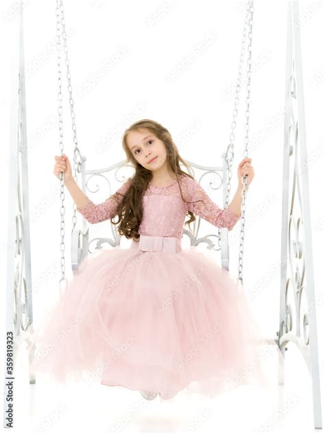 Beautiful Preteen Girl Sitting On Elegant Metal Swing Stock Photo