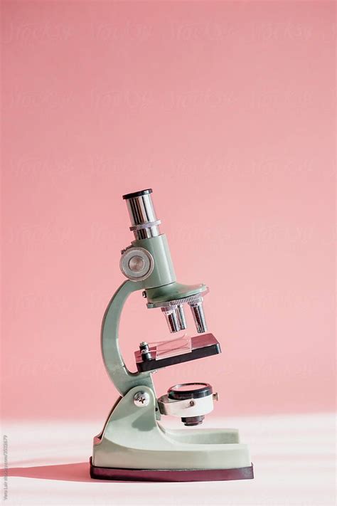 Small Microscope On A Pink Background By Stocksy Contributor Vera