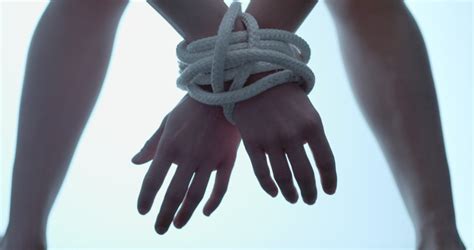 woman wrist tied up with stock footage video 100 royalty free 1031405435 shutterstock