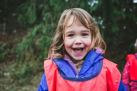 Cute Young Girl Having Fun Outside At Nature Preschool By Rob And Julia