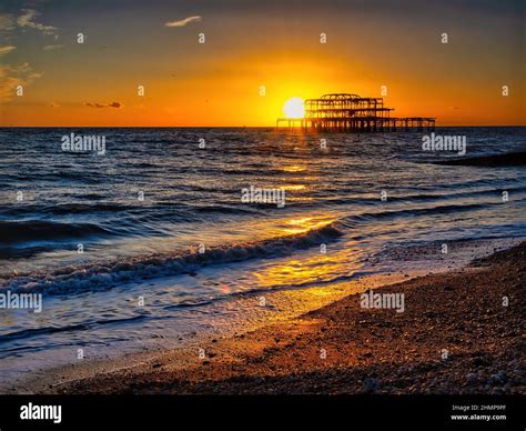 The Iconic West Pier In Brighton Draws Crowds Of People Every Evening