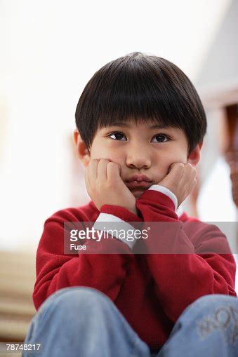 Boy Sulking On Stairs High Res Stock Photo Getty Images