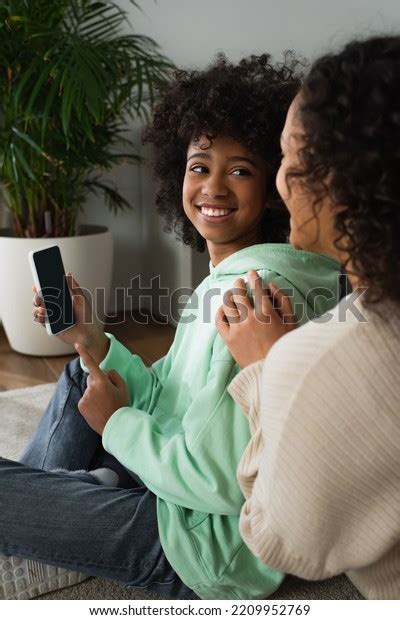Happy African American Preteen Girl Holding Stock Photo 2209952769