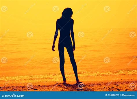 Silhouette Of A Skinny Young Girl Walking Along The Beach Stock Image Image Of Dawn Naturist