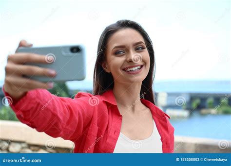 Young Woman Taking Selfie On Riverside Stock Photo Image Of Beautiful