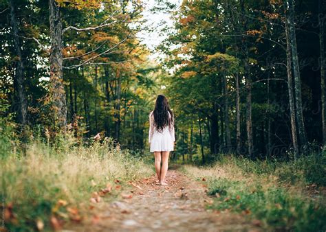 A Beautiful Babe Woman Walks Alone In A Dark Woods Del Colaborador De Stocksy HOWL Stocksy