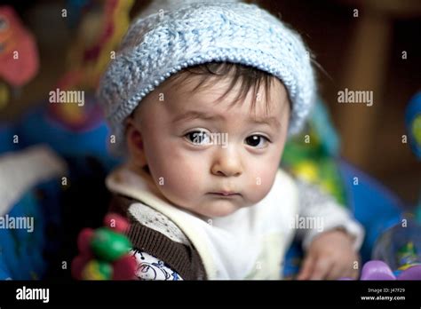 Mixed Race Asian Caucasian Baby Boy Large Brown Eyes In A Blue Knit