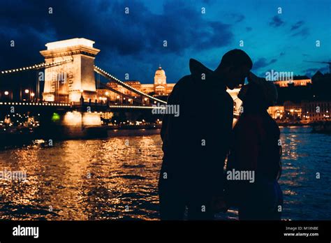 Romantic Silhouettes Portrait Of The Loving Couple Almost Kissing At The Background Of The